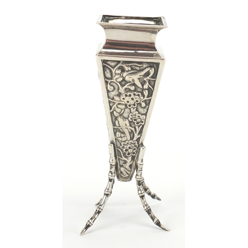 524 - Chinese silver vase of square tapering form with simulated bamboo legs, embossed with birds of parad... 