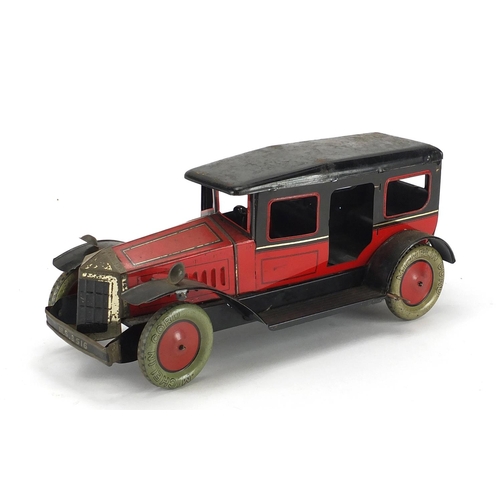 406 - Tin plate clockwork saloon car with Michelin cord tyres, with box, 36cm in length