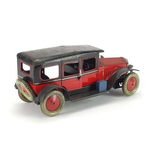 406 - Tin plate clockwork saloon car with Michelin cord tyres, with box, 36cm in length