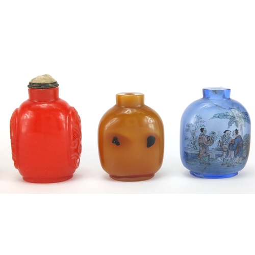 487 - Five Chinese snuff bottles including two glass examples hand painted to the interior, one with a riv... 