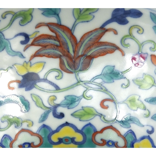 415 - Chinese porcelain Doucai dish, hand painted with the eight daoist emblems and with flowers amongst f... 