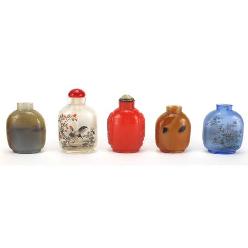 487 - Five Chinese snuff bottles including two glass examples hand painted to the interior, one with a riv... 