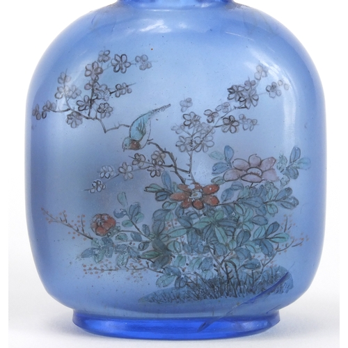 487 - Five Chinese snuff bottles including two glass examples hand painted to the interior, one with a riv... 