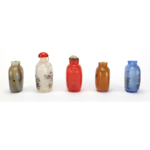 487 - Five Chinese snuff bottles including two glass examples hand painted to the interior, one with a riv... 