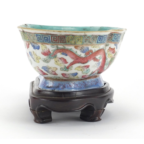419 - Chinese porcelain footed bowl with turquoise interior on shaped hardwood stand, hand painted in the ... 