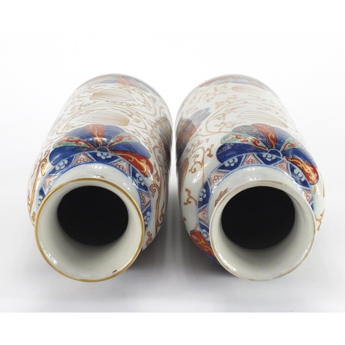 421 - Pair of Chinese porcelain cylindrical vases, possibly Kangxi period, both hand painted in the Imari ... 