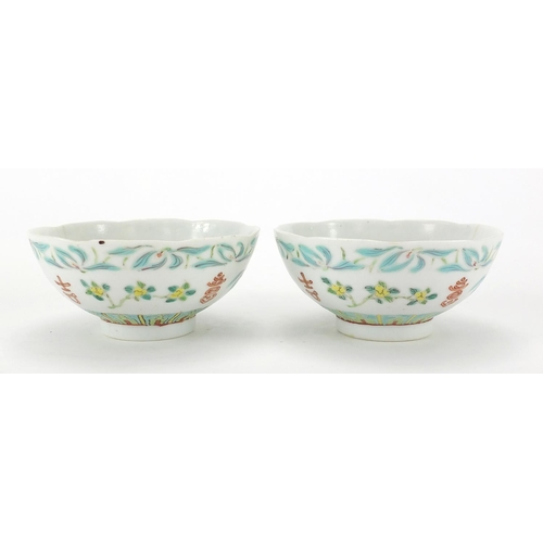 424 - Pair of Chinese porcelain footed bowls, hand panted with flowers, six figure iron red character mark... 