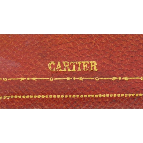 56 - Cartier tooled leather case stamped Cartier to the reverse, 10cm high