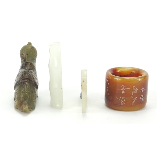 498 - Chinese jade carvings including a mythical animal, thumb ring and a pendant carved with a dragon, th... 