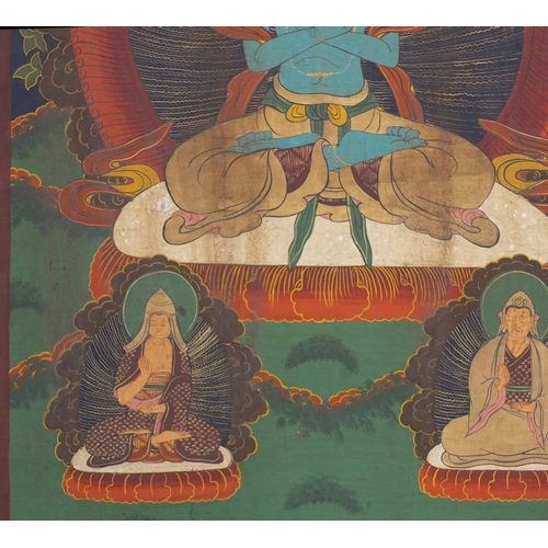 540 - Two Tibetan watercolour on silk Thang-Ga, both with deities, the largest 70cm x 49cm