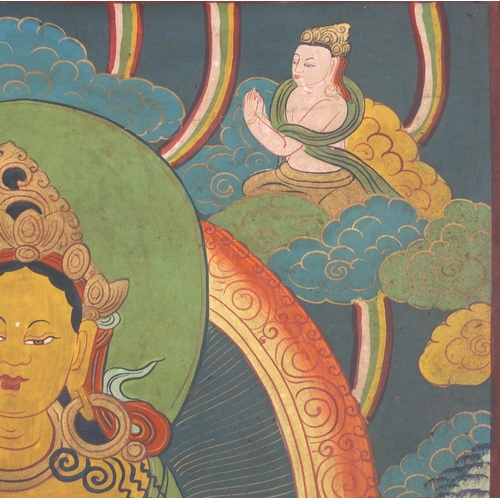 540 - Two Tibetan watercolour on silk Thang-Ga, both with deities, the largest 70cm x 49cm