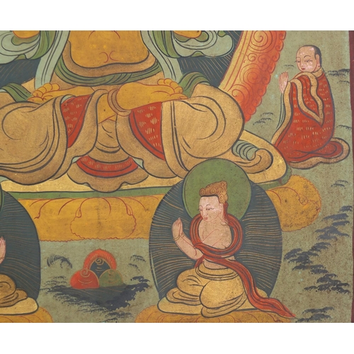 540 - Two Tibetan watercolour on silk Thang-Ga, both with deities, the largest 70cm x 49cm