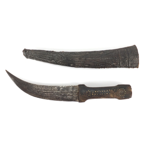 580 - Middle Eastern knife with sheath and horn handle, possibly rhino horn, 35cm in length