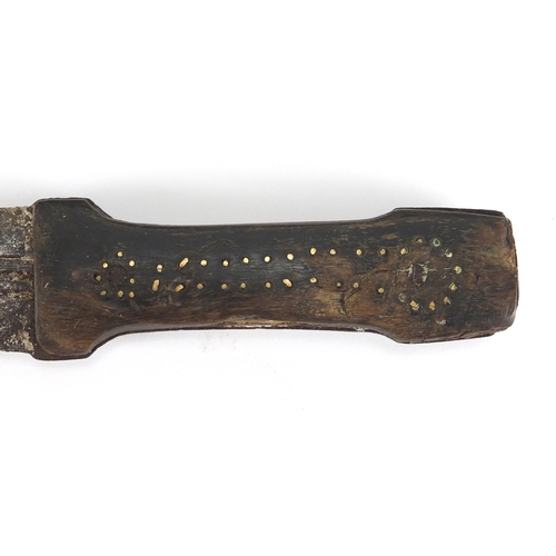 580 - Middle Eastern knife with sheath and horn handle, possibly rhino horn, 35cm in length