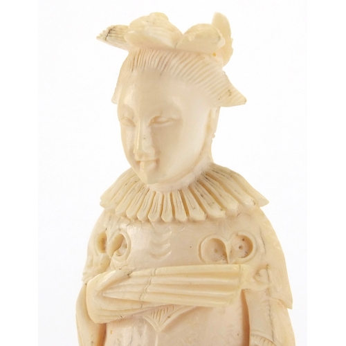 508 - Two Chinese carved ivory chess pieces, and Emperor and an Empress, each approximately 8cm high