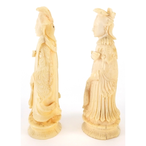 508 - Two Chinese carved ivory chess pieces, and Emperor and an Empress, each approximately 8cm high