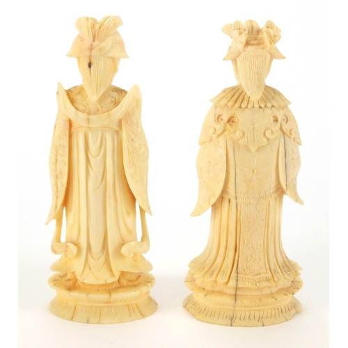 508 - Two Chinese carved ivory chess pieces, and Emperor and an Empress, each approximately 8cm high