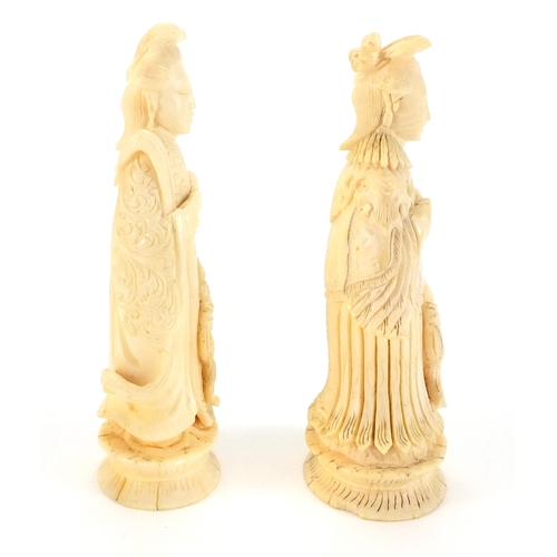 508 - Two Chinese carved ivory chess pieces, and Emperor and an Empress, each approximately 8cm high