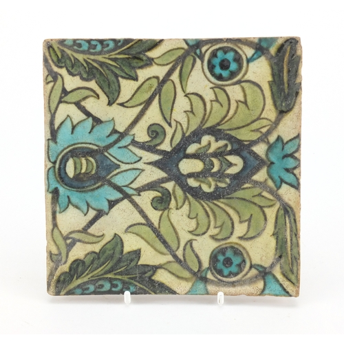 654 - William De Morgan pottery tile hand painted with stylised foliage, impressed W DE Morgan to the reve... 