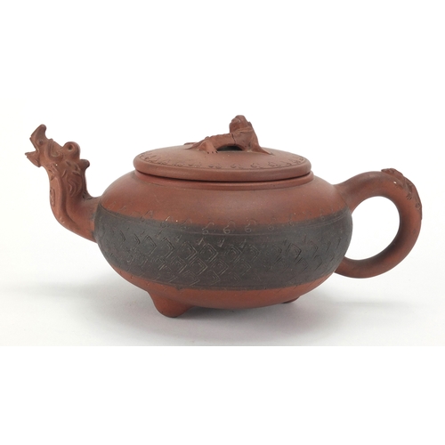 462 - Chinese Yixing terracotta teapot with dragon spout and incised decoration, impressed marks to the ba... 