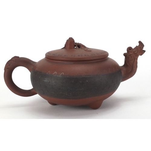 462 - Chinese Yixing terracotta teapot with dragon spout and incised decoration, impressed marks to the ba... 