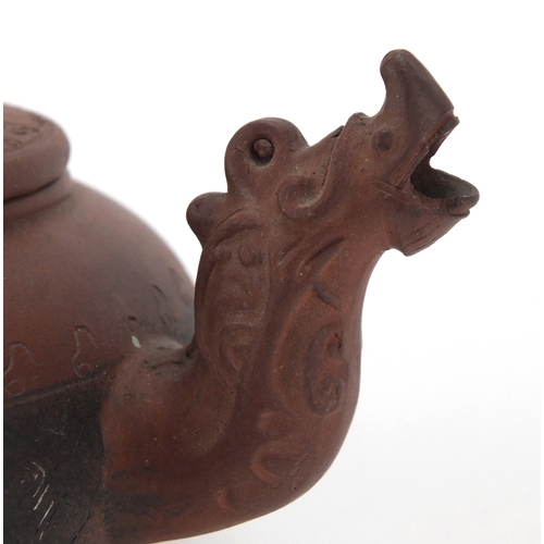 462 - Chinese Yixing terracotta teapot with dragon spout and incised decoration, impressed marks to the ba... 