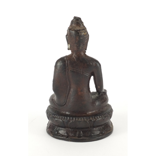 470 - Tibetan painted metal figure of Buddha seated in the lotus position, 13cm high