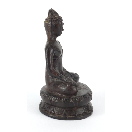 470 - Tibetan painted metal figure of Buddha seated in the lotus position, 13cm high