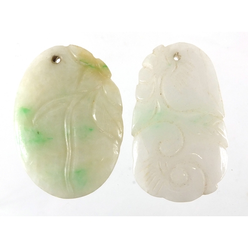 492 - Two Chinese carved green and white jade pendants, the largest 4cm high