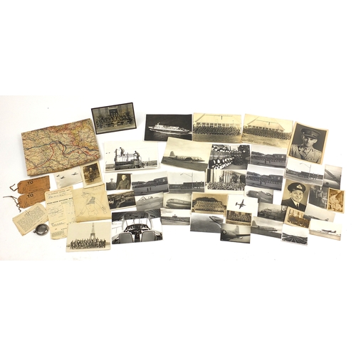 319 - Military interest ephemera and photographs including a fold out map, photographs of ships, planes an... 