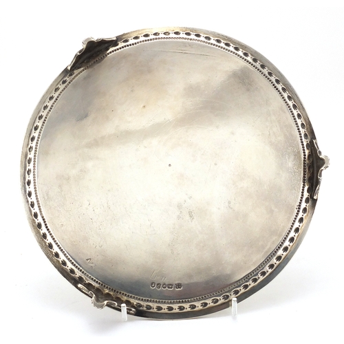 727 - Victorian silver three footed salver with all over engraved decoration, D.H G.H London 1870, 20.5cm ... 