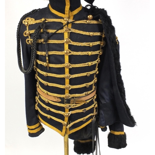 320 - Military interest uniform on mannequin including a Busby hat, Shoulder coat and sabatash, 195cm high