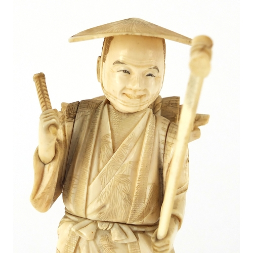 504 - Japanese carved ivory okimono of a fisherman, 17cm high