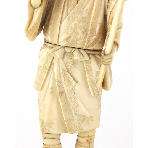 504 - Japanese carved ivory okimono of a fisherman, 17cm high