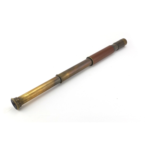 124 - Military interest two drawer brass telescope, leather bound, 26cm in length when closed