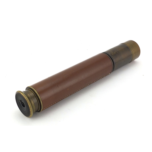 124 - Military interest two drawer brass telescope, leather bound, 26cm in length when closed