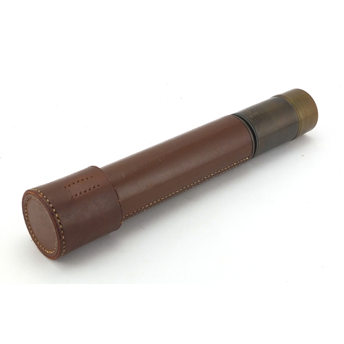 124 - Military interest two drawer brass telescope, leather bound, 26cm in length when closed