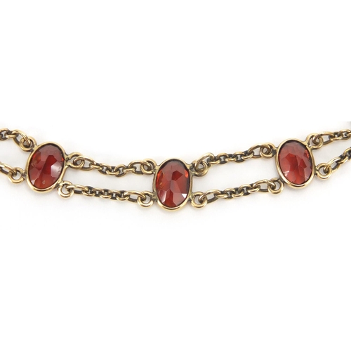 868 - 9ct gold garnet necklace and bracelet, the necklace 44cm in length, approximate weight 12.5g