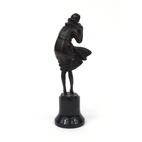 2066 - Bronze study of an Art Deco female wearing hand warmers, raised on a circular marble base, overall 3... 