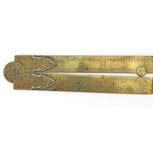 121 - 19th century brass rule together with two brass and boxwood rulers including a sliding example by F ... 