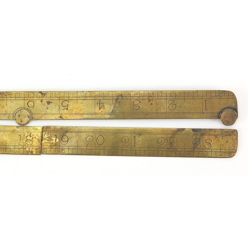 121 - 19th century brass rule together with two brass and boxwood rulers including a sliding example by F ... 