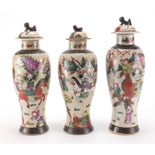 431 - Three Chinese crackle glazed baluster vases and covers, including a pair, all hand painted in the fa... 