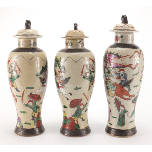 431 - Three Chinese crackle glazed baluster vases and covers, including a pair, all hand painted in the fa... 