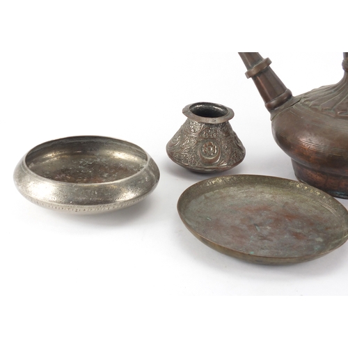 558 - Middle Eastern metalware including a copper jug, pot and cover and vase embossed with foliate motifs... 