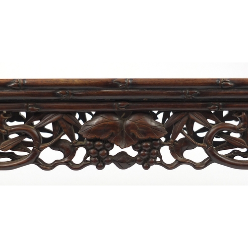 463 - Chinese rosewood hall bench, carved with foliage and berries, 53cm H x 105cm W x 34.5cm D