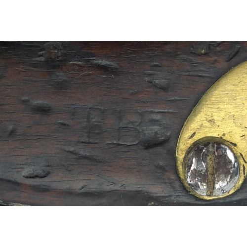 353 - Antique flint lock pistol with brass mounts, engraved Tower, GR emblem and proof marks, initialled T... 