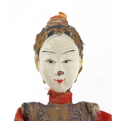 519 - Two Chinese bowls including a hand painted paper mache boy in traditional dress, the largest 25cm in... 