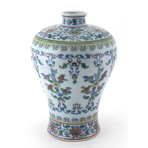 413 - Chinese porcelain Doucai vase, hand painted in the with flower heads amongst foliate scrolls and fol... 