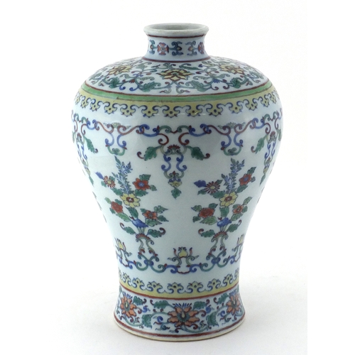 413 - Chinese porcelain Doucai vase, hand painted in the with flower heads amongst foliate scrolls and fol... 