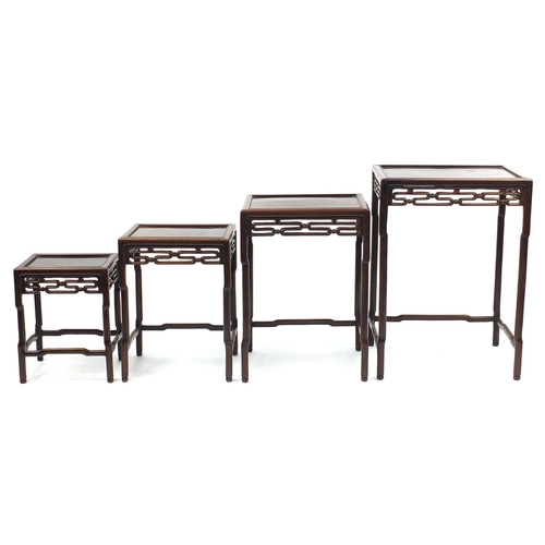 463a - Chinese rosewood quartetto nest of occasional tables, each with pierced carving, the largest 71.5cm ... 